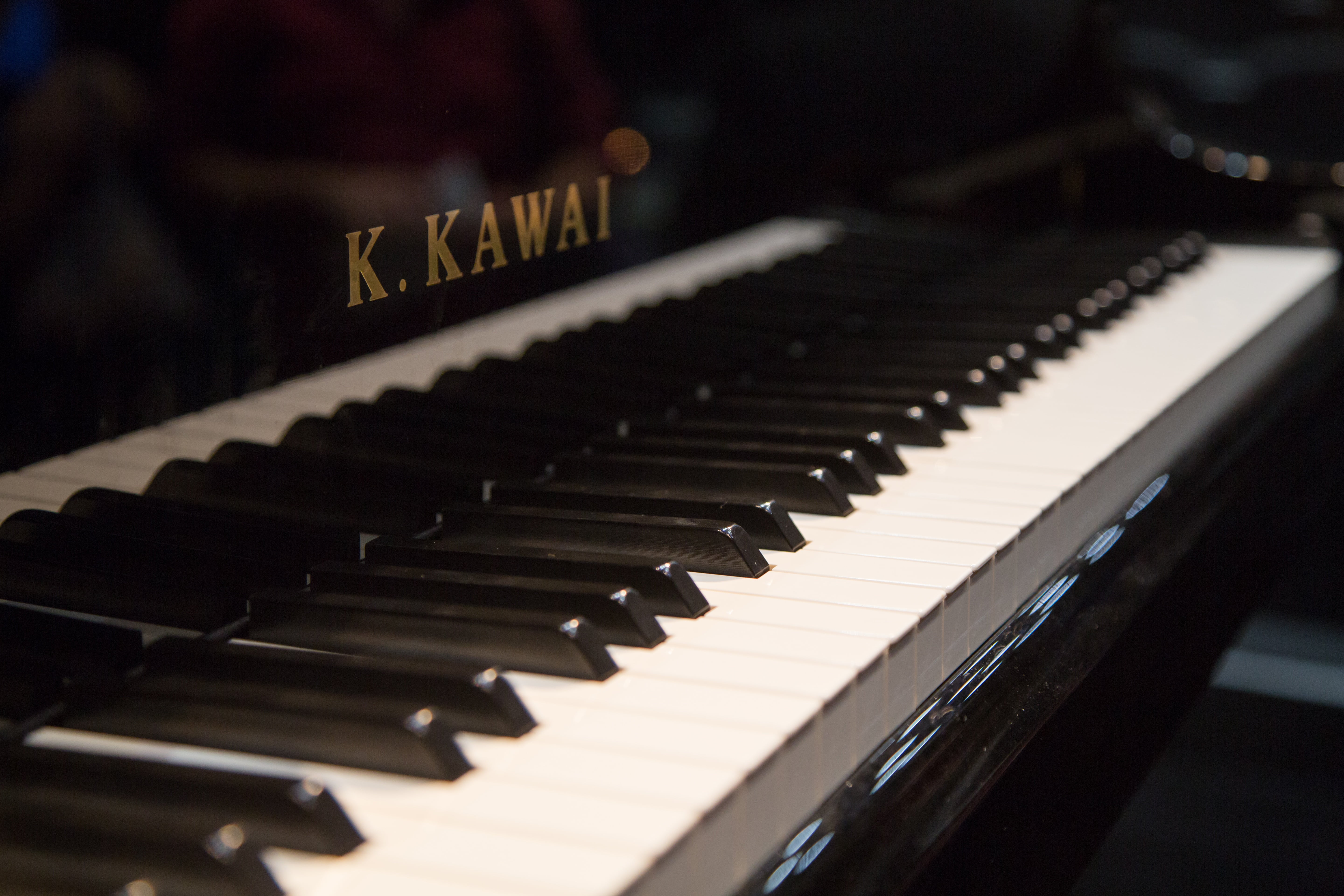 Close view of a Kawai grand piano keyboard